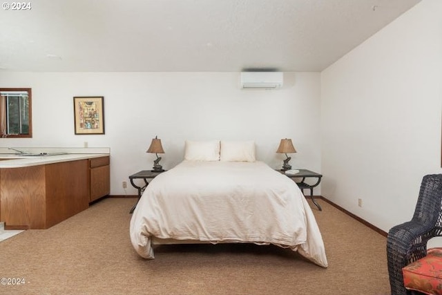 bedroom featuring a wall unit AC, light carpet, and baseboards