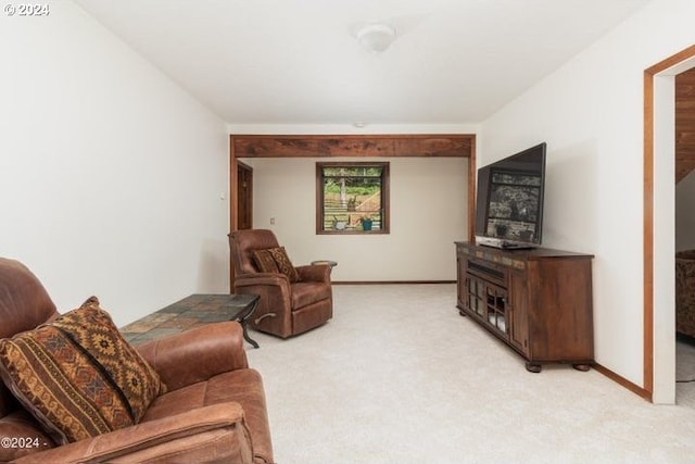 living room with light colored carpet and baseboards
