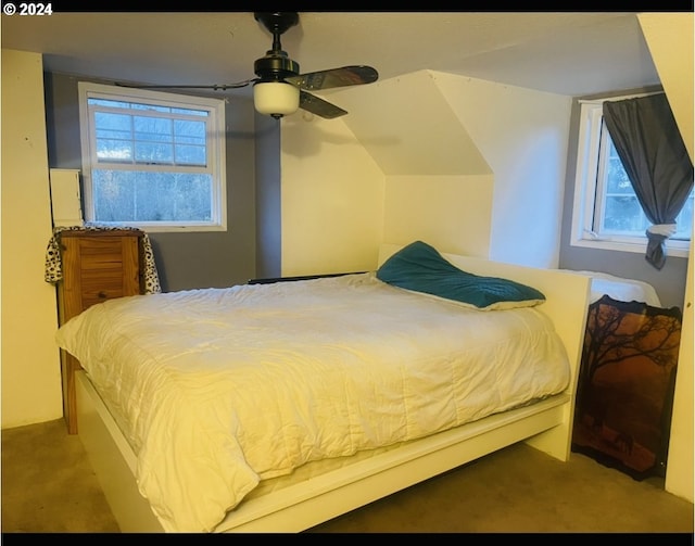 carpeted bedroom with multiple windows and ceiling fan