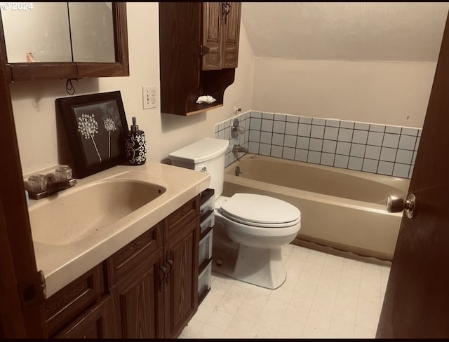 bathroom featuring a washtub, toilet, and vanity