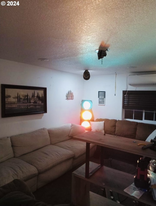 living room with a textured ceiling and a wall mounted AC