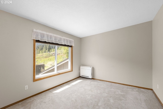 empty room featuring carpet flooring