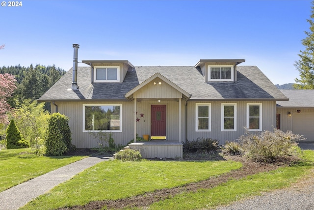 view of front facade with a garage and a front yard