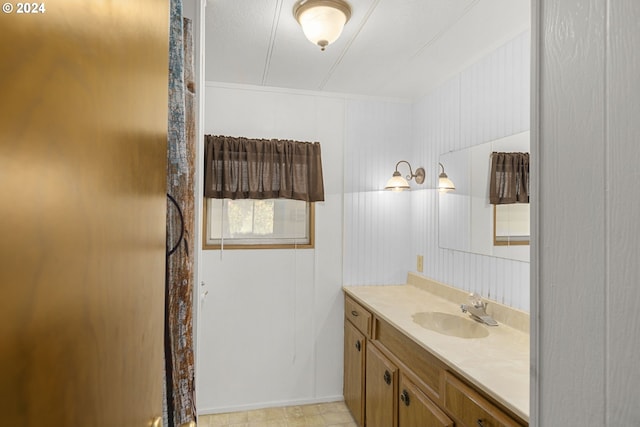 bathroom with tile flooring and oversized vanity