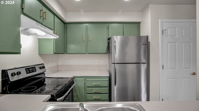 kitchen featuring black range with electric cooktop, green cabinets, and stainless steel fridge