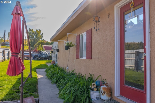 view of property exterior featuring a lawn