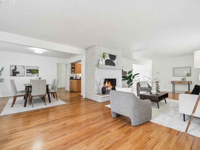 6325 SW Elm Ave, Beaverton, OR 97005 - living area featuring light wood-style flooring and a fireplace