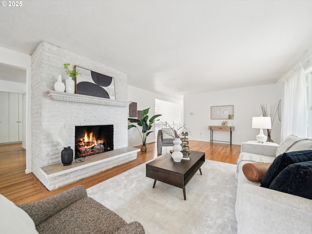 6325 SW Elm Ave, Beaverton, OR 97005 - living area with a brick fireplace and wood finished floors