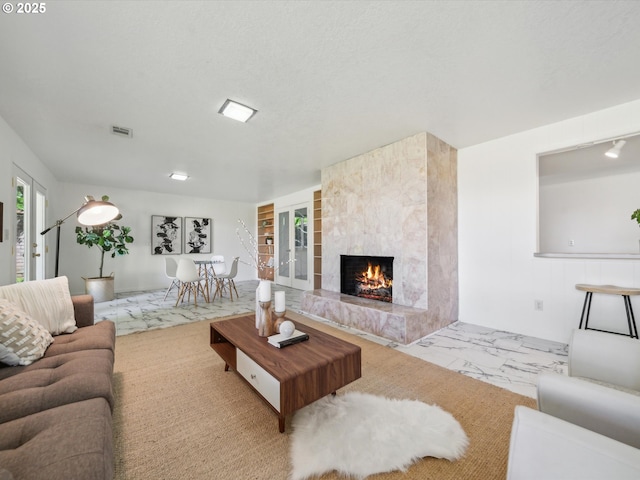 6325 SW Elm Ave, Beaverton, OR 97005 - living room with a high end fireplace and marble finish floors