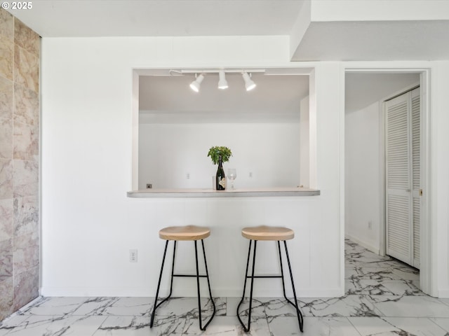 6325 SW Elm Ave, Beaverton, OR 97005 - unfurnished dining area with light marble finish floors and rail lighting