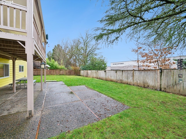 view of yard featuring a patio area and a fenced backyard