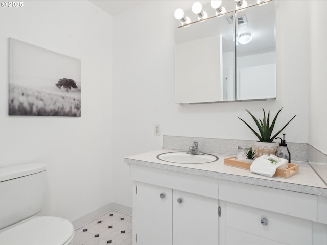 6325 SW Elm Ave, Beaverton, OR 97005 - half bathroom featuring vanity, toilet, and baseboards
