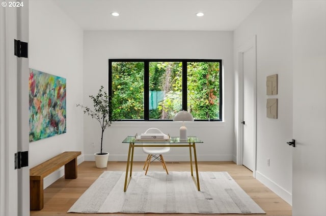 office with light hardwood / wood-style flooring