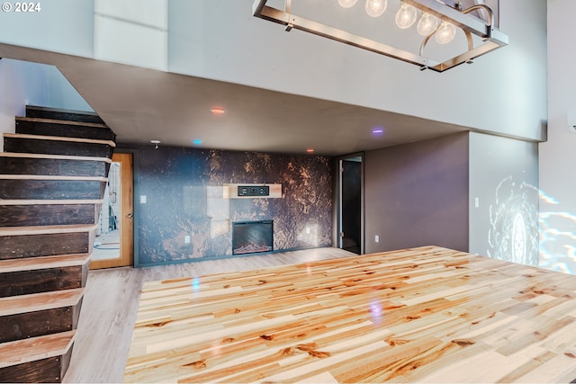 unfurnished living room with wood-type flooring