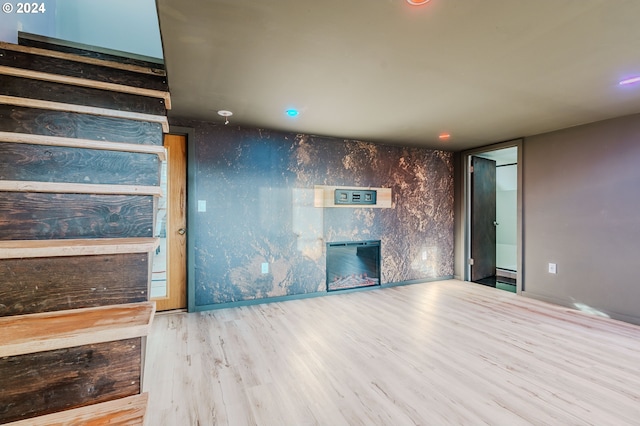 unfurnished living room featuring light wood-type flooring