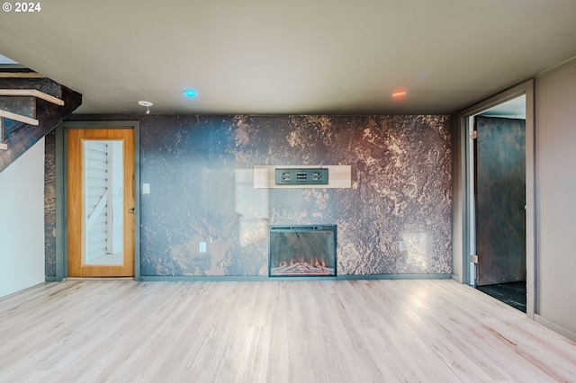 unfurnished room featuring hardwood / wood-style floors