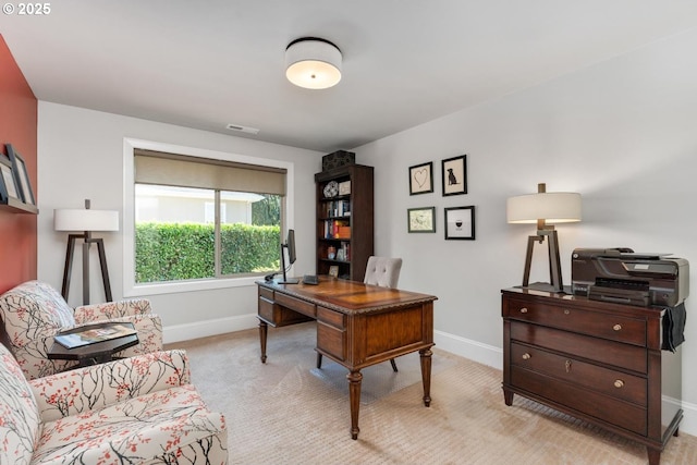 carpeted office with visible vents and baseboards