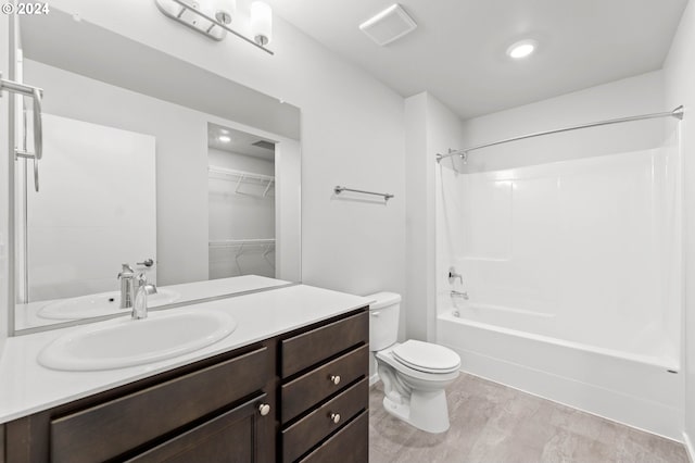 full bathroom featuring vanity, toilet, and bathtub / shower combination