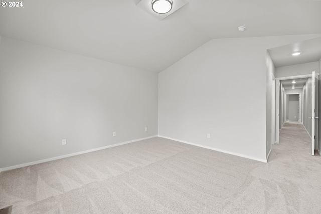 bonus room featuring light carpet and lofted ceiling