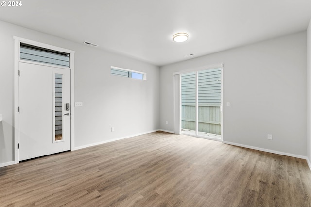 unfurnished room featuring hardwood / wood-style floors