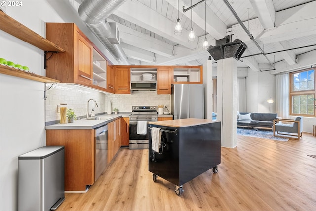 kitchen with appliances with stainless steel finishes, light hardwood / wood-style floors, beam ceiling, sink, and decorative light fixtures