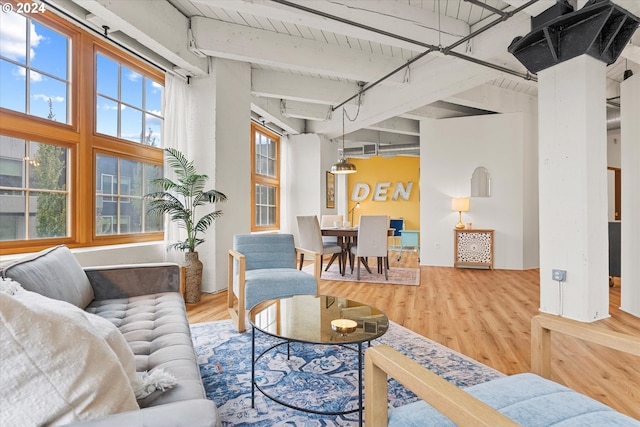 living room with hardwood / wood-style floors, wood ceiling, and beam ceiling