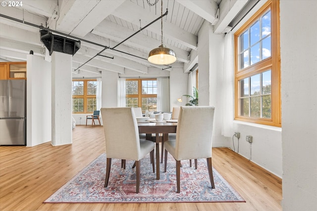 dining room featuring wood ceiling, vaulted ceiling with beams, and hardwood / wood-style flooring