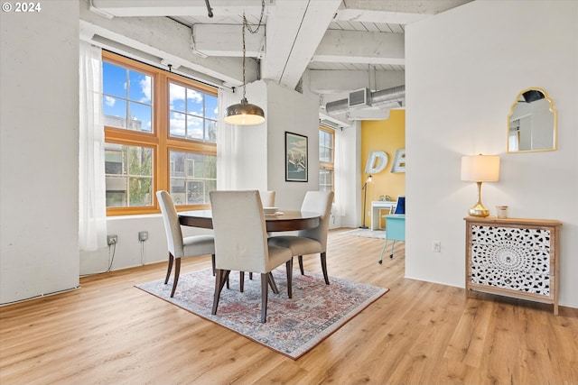 dining space featuring wooden ceiling, light hardwood / wood-style floors, and beamed ceiling