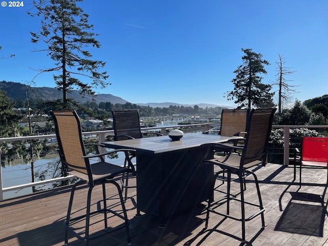 wooden deck with a mountain view