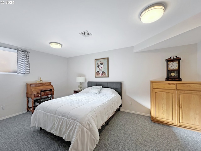 bedroom with dark carpet