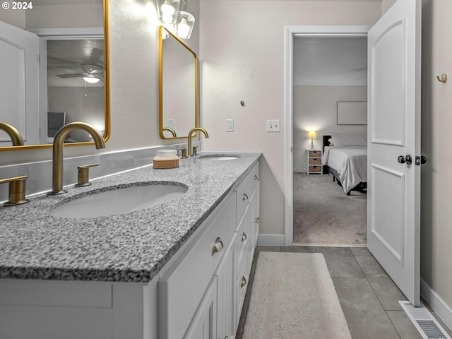 bathroom featuring vanity, ceiling fan, and tile patterned floors