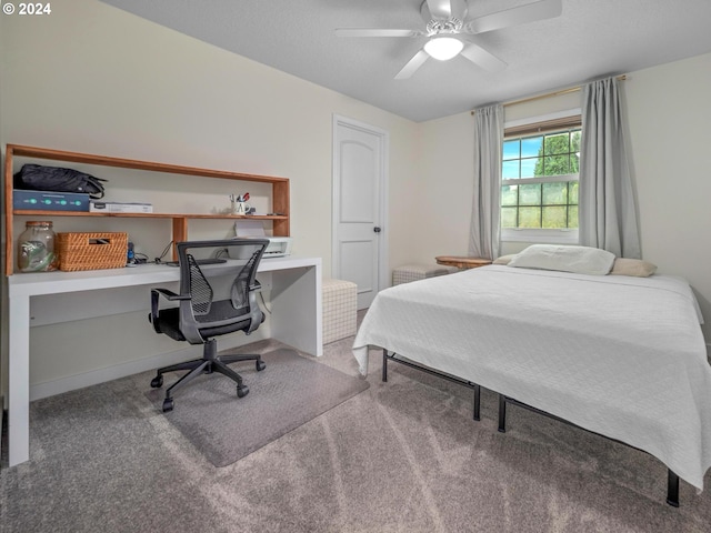 bedroom with ceiling fan and carpet floors