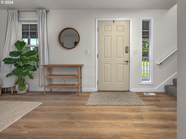 entryway featuring a textured ceiling and hardwood / wood-style floors