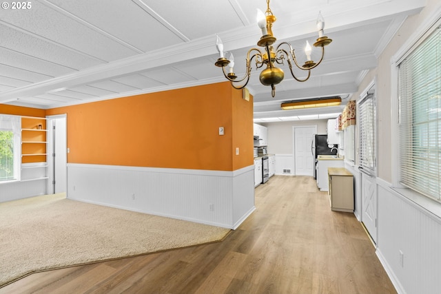 5213 Hilltop Dr, Florence, OR 97439 - hallway featuring a wainscoted wall, a chandelier, light wood finished floors, beam ceiling, and ornamental molding