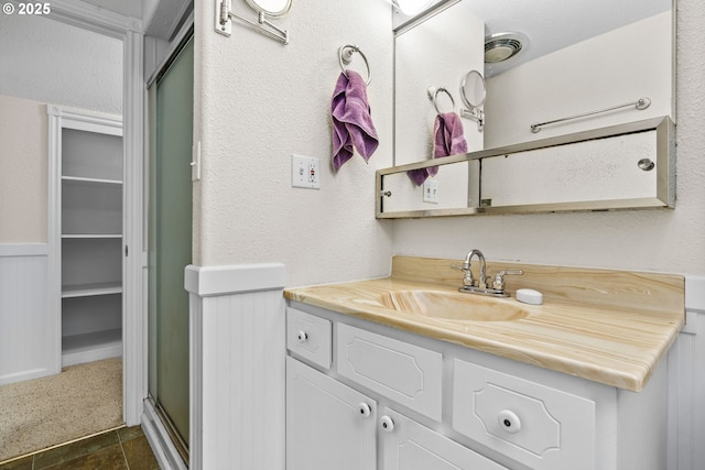 5213 Hilltop Dr, Florence, OR 97439 - bathroom with a stall shower, vanity, and a walk in closet