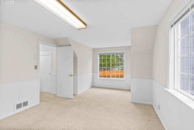 5213 Hilltop Dr, Florence, OR 97439 - spare room featuring a wainscoted wall and carpet