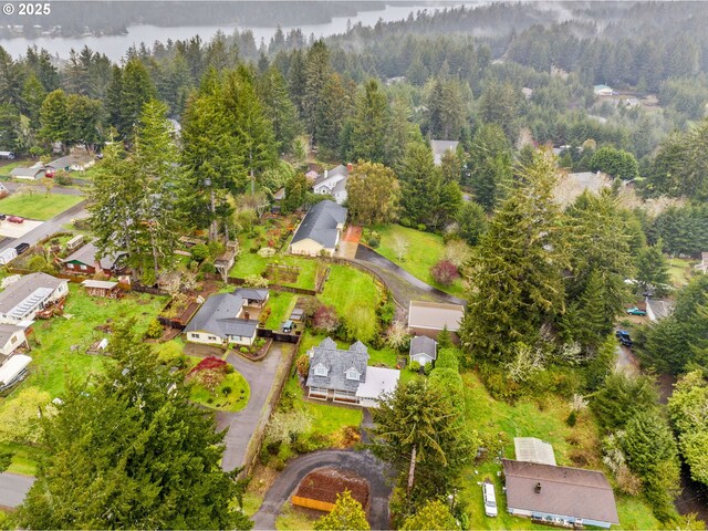 5213 Hilltop Dr, Florence, OR 97439 - aerial view of residential area with a heavily wooded area