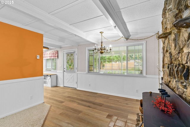 5213 Hilltop Dr, Florence, OR 97439 - dining room featuring wainscoting, wood finished floors, a chandelier, and beamed ceiling
