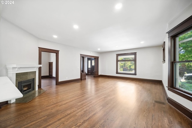 unfurnished living room with dark wood-type flooring