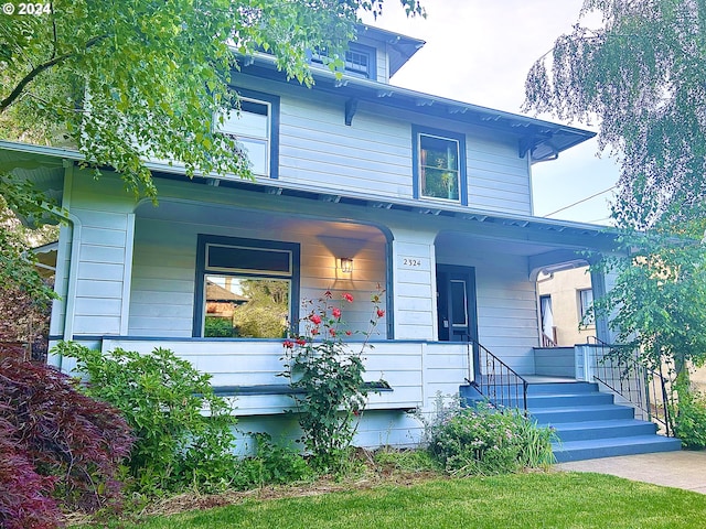 view of front of property featuring covered porch