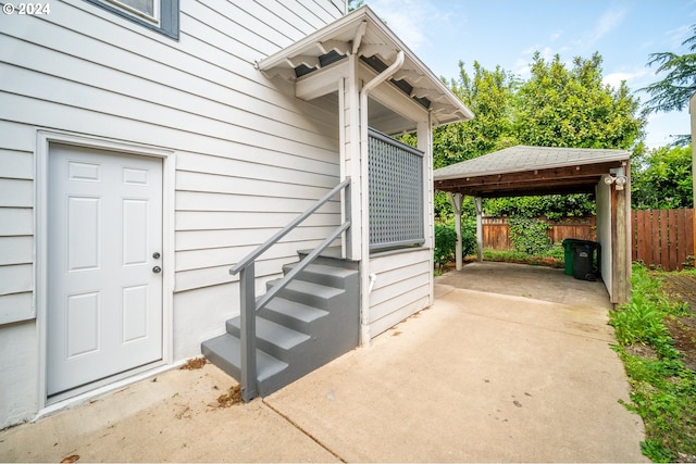 view of exterior entry featuring a patio