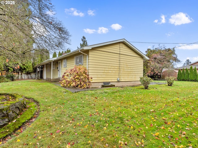 view of home's exterior featuring a yard