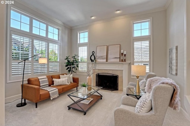 living room featuring crown molding, light colored carpet, and a tile fireplace