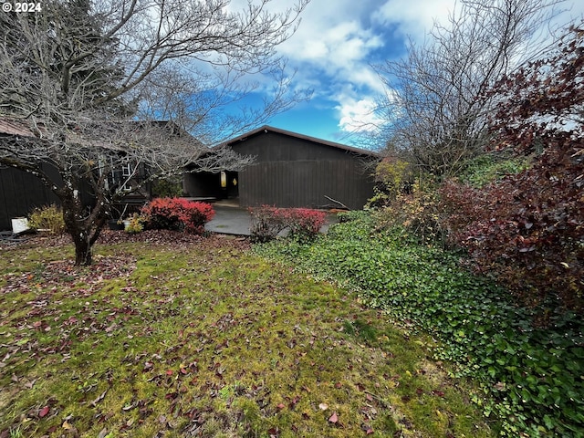 view of side of property with a patio area