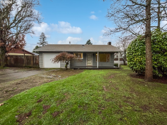 view of front of home with a garage and a front lawn