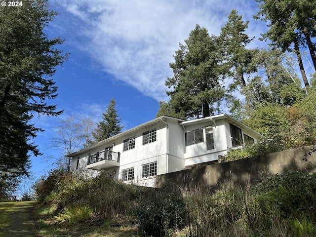 view of property exterior with a balcony