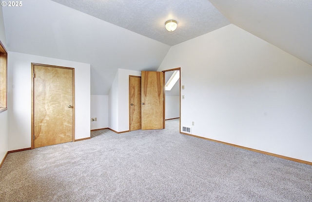 34540 Nestucca Blvd, Cloverdale, OR 97112 - unfurnished bedroom featuring carpet flooring, vaulted ceiling, and baseboards