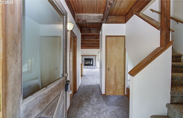 34540 Nestucca Blvd, Cloverdale, OR 97112 - hallway with wooden ceiling with exposed beams, carpet, and stairs