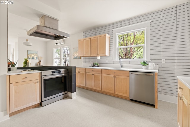 kitchen featuring light brown cabinetry, appliances with stainless steel finishes, and sink