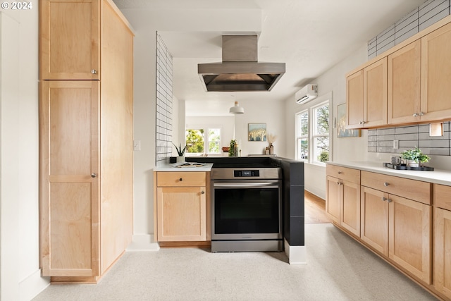 kitchen with a wealth of natural light, exhaust hood, and light brown cabinets